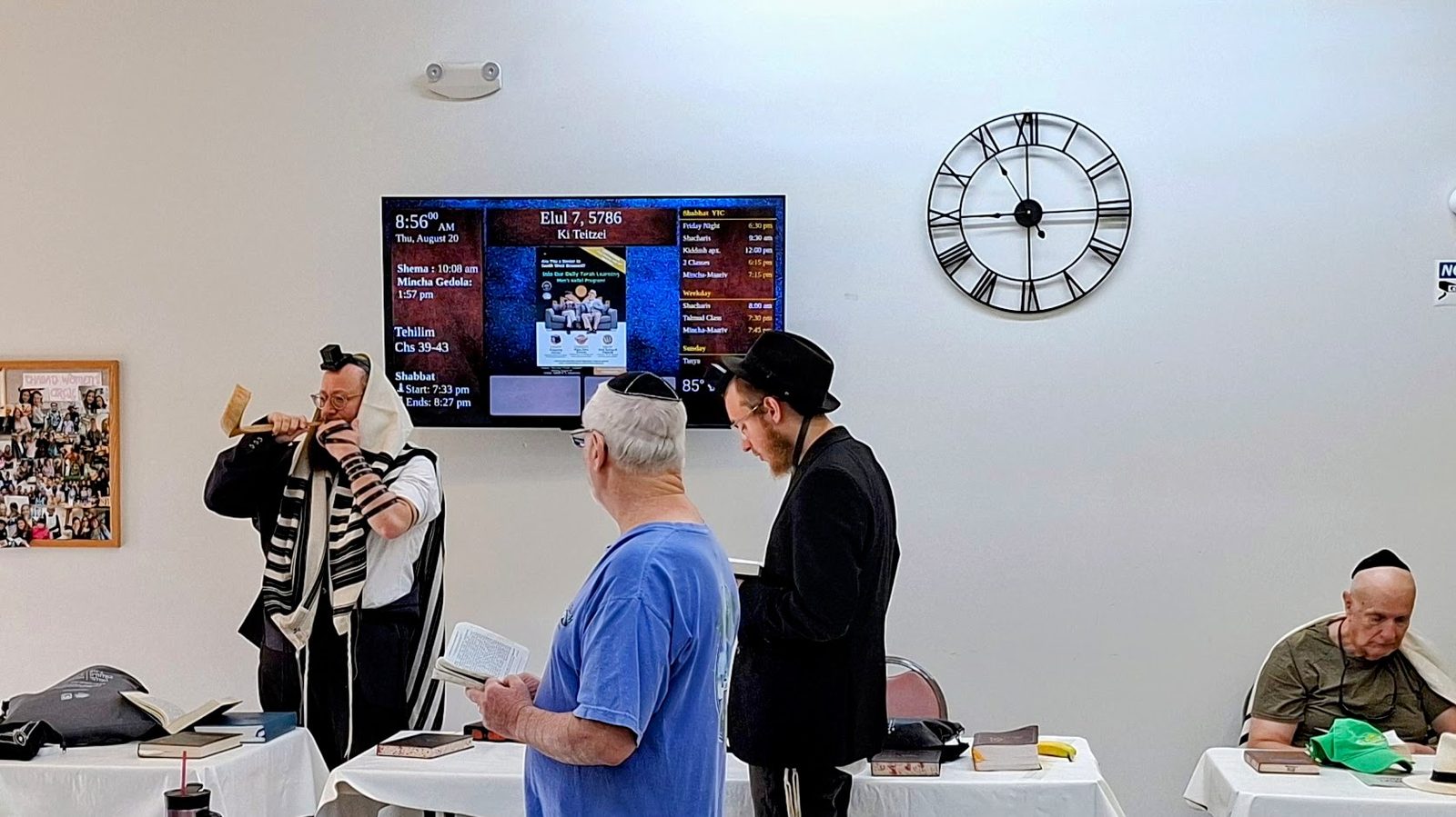 Elul minyan at Young Israel Chabad of Pembroke Pines with the DigitalShul zmanim display on the wall